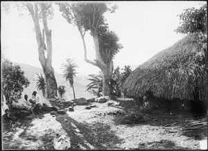 House and men at an old sacrificial site, Chome, Tanzania, ca. 1900-1914