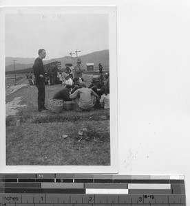 Maryknoll Father with refugees at Hong Kong, China, 1939