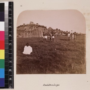 Indigenous men transporting two missionaries by filanjana, Madagascar, ca. 1865-1885