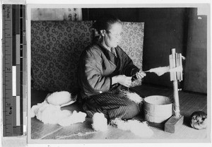 Woman spinning silk thread, Japan, August 1932