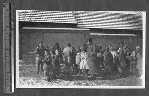 Student assisting refugees, Jinan, Shandong, China, 1927-1928