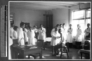 Staff examination of patient, Jinan, Shandong, China, 1941