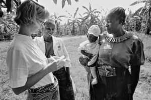 Missionary Nurse Karen Kjær Baggesgaard and a local coworker talking with patient at the ELCT d