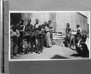 Villagers reading books brought by Harwood Bible Training School students, Fenyang, Shanxi, China, 1936