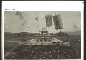 A decorated chinese grave in San Ning near Canton, with a soul house built on it