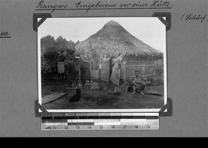 Africans in front of their house, Rungwe, Tanzania