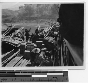 Unloading cargo at Luoding, China, 1926