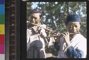 Miao youths playing flutes, south west China, ca. 1949