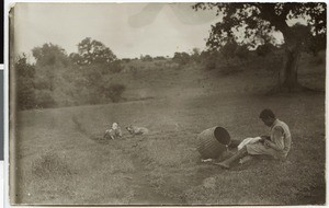 Shepherd mending his clothes, Ethiopia