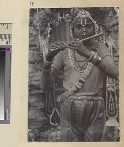 Boy dressed up to represent Krishna, Arakkonam, India, ca.1920