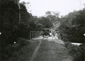 Missionaries on a bridge, in Gabon