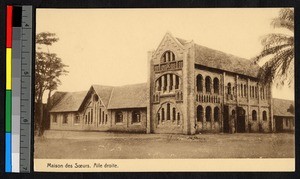 Large brick mission building standing on cleared ground, Congo, ca.1920-1940