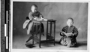 Two children reading, Japan, ca. 1920-1940