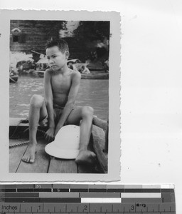 A boy on the dock at Gaozhou, China, 1935