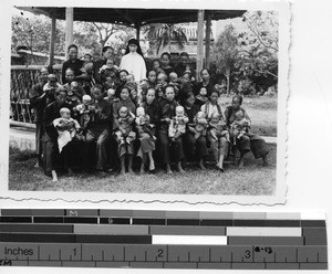 Sr. Richard with nurses and orphans at Luoding, 1937