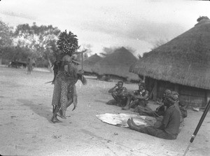 African sorcerer dancing in front of a hut, Matutwini, Mozambique