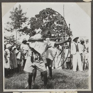 Shooting with bow and arrows, Tanzania, ca.1927-1938