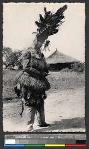 Man in ceremonial mask and costume, Kasai, Congo, ca.1920-1940