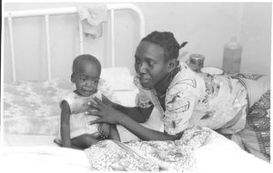 ELCT, Karagwe Diocese, Tanzania. Mother with her daughter, suffering from illness, Nyakahanga H