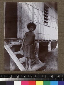 Portrait of girl outside mission school, Delena, Papua New Guinea, ca.1905-1915