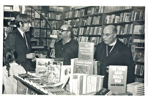 Books are discussed during the opening of the new bookshop, 1971 To the left in the picture is