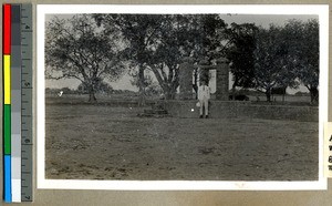 Mr. Norton standing by a well on land intended for Industrial Work, Vārānasi , India, ca. 1920