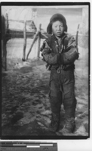 A poor boy in tattered clothes at Fushun, China, 1937