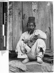 Older man smoking, Korea, ca. 1920-1940