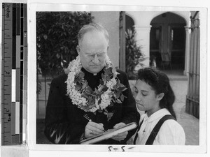 Bishop Lane with a Maryknoll schoolgirl, Honolulu, Hawaii, 1941