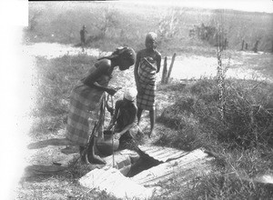 African girls at the well, Ricatla, Mozambique, 1929