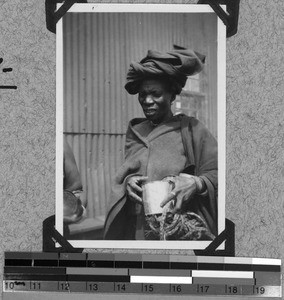 A woman holding a can, Baziya, South Africa East