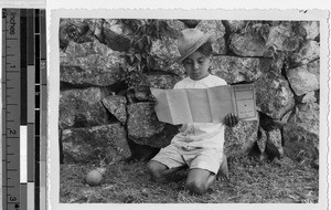 Panchito reading a map of Quintana Roo, Mexico, ca. 1944