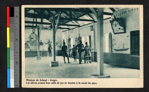 People within a room with painted walls, Congo, ca.1920-1940