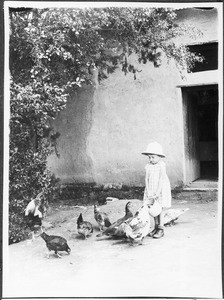 Irmgard Guth feeding ducks and chickens, Tanzania, ca. 1927-1938