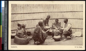 Indigenous men and women gather for a meal, Lesotho, ca.1900-1930