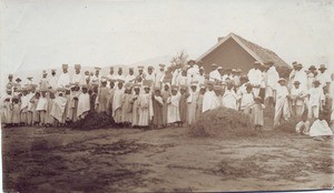 Malagasy people carrying stones on their head, in Madagascar