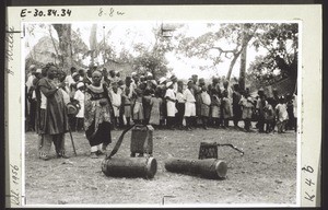 A great crowd of people assembled in Bali to celebrate the 50th anniversary of the Basel Mission in the Grassfields (17.May 1953).On the right by the drum