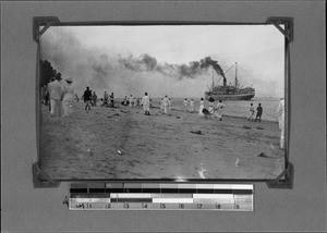 People watching a steamer in the harbour, Dar es Salaam, Tanzania