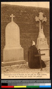 Woman kneeling at a gravesite, India, ca.1920-1940