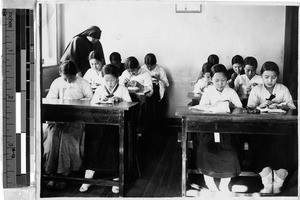 Twelve Korean girls practicing embroidery at Maryknoll Industrial School, Yeng You, Korea, 1937