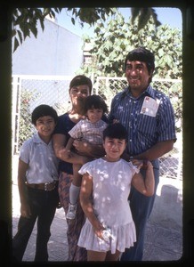 Family outside their home