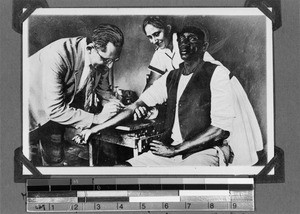 Fischer M.D. treats a student, Rungwe, Tanzania, 1929