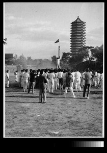 Pole climbing at Play Day, Yenching University, Beijing, China, 1938
