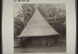 African hut with magic flags