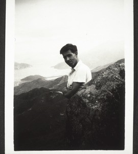 Journey to China and its interior 1937. 27. Oct. 1937. Hans on the mountain which we climbed together. In the background an arm of the sea coming in from the east coast