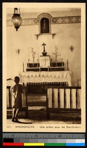 Young boy standing before an altar, Madagascar, ca.1920-1940