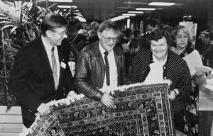 Annual meeting 1989 Broenderslev. Iver Brogaard (center) shows a blanket pastor Svend Erik Lang