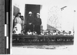 Maryknoll Sisters and Priests feed orphans, Loting, China, ca. 1927