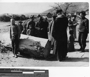 Fr. Geselbracht with a Chinese family in Fushun, China, 1940