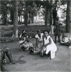 Girls selling bottles of "Ndijiindia", in Cameroon